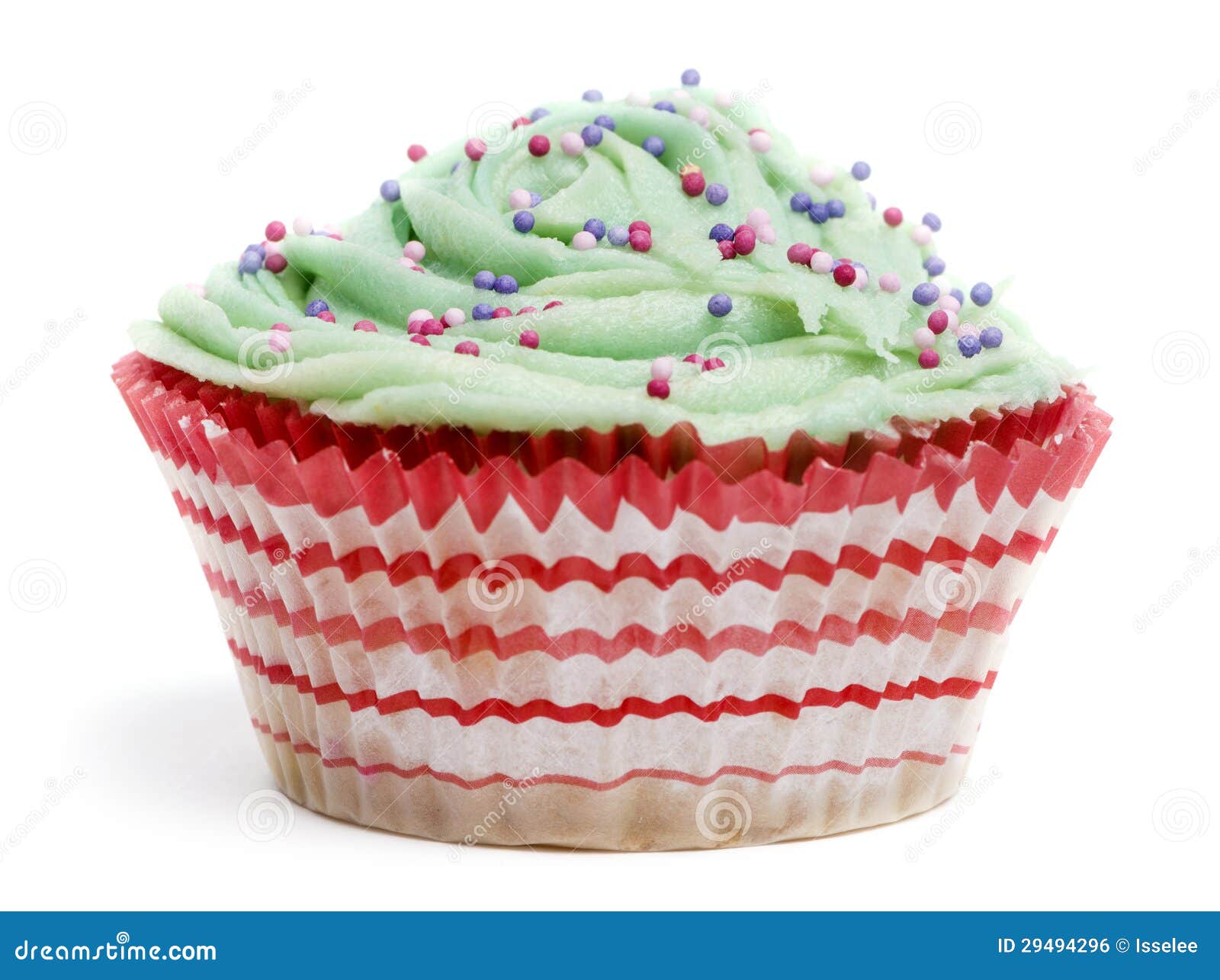 cupcake with green icing and hundreds and thousands against white background