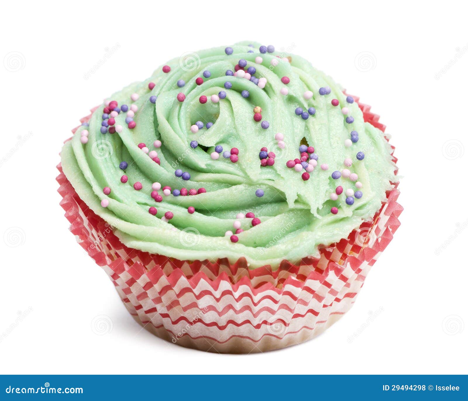cupcake with green icing and hundreds and thousands against white background
