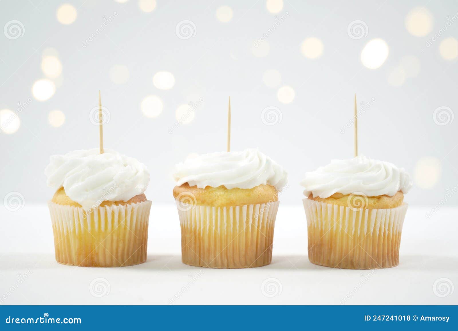 cupcake topper mockup. white background with bokeh party fairy lights.