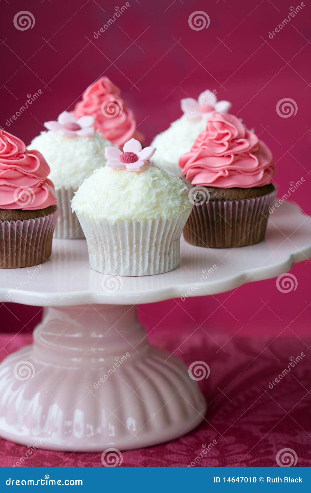 Pink and white cupcakes on a cakestand