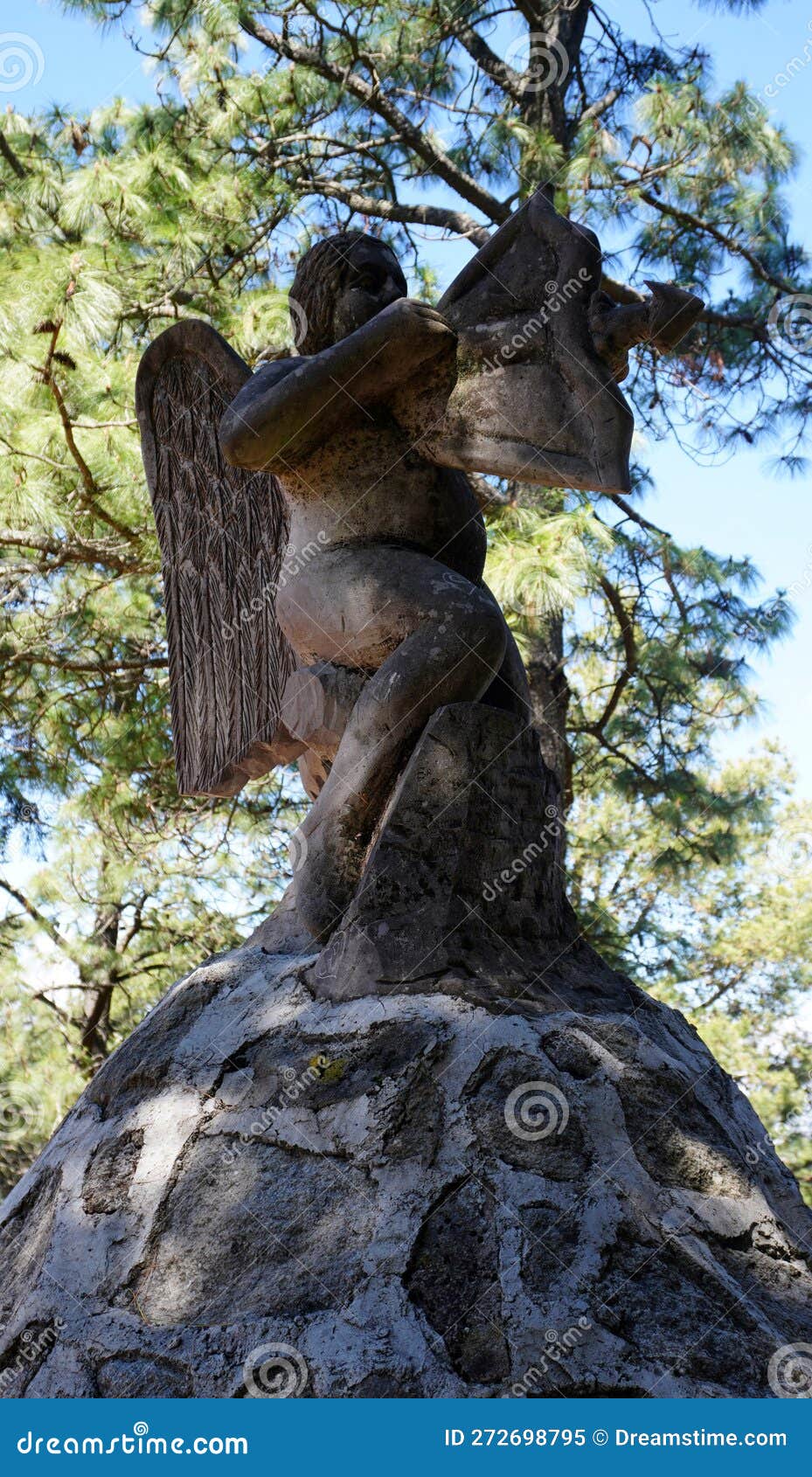 cupid rock sculpture in the woods