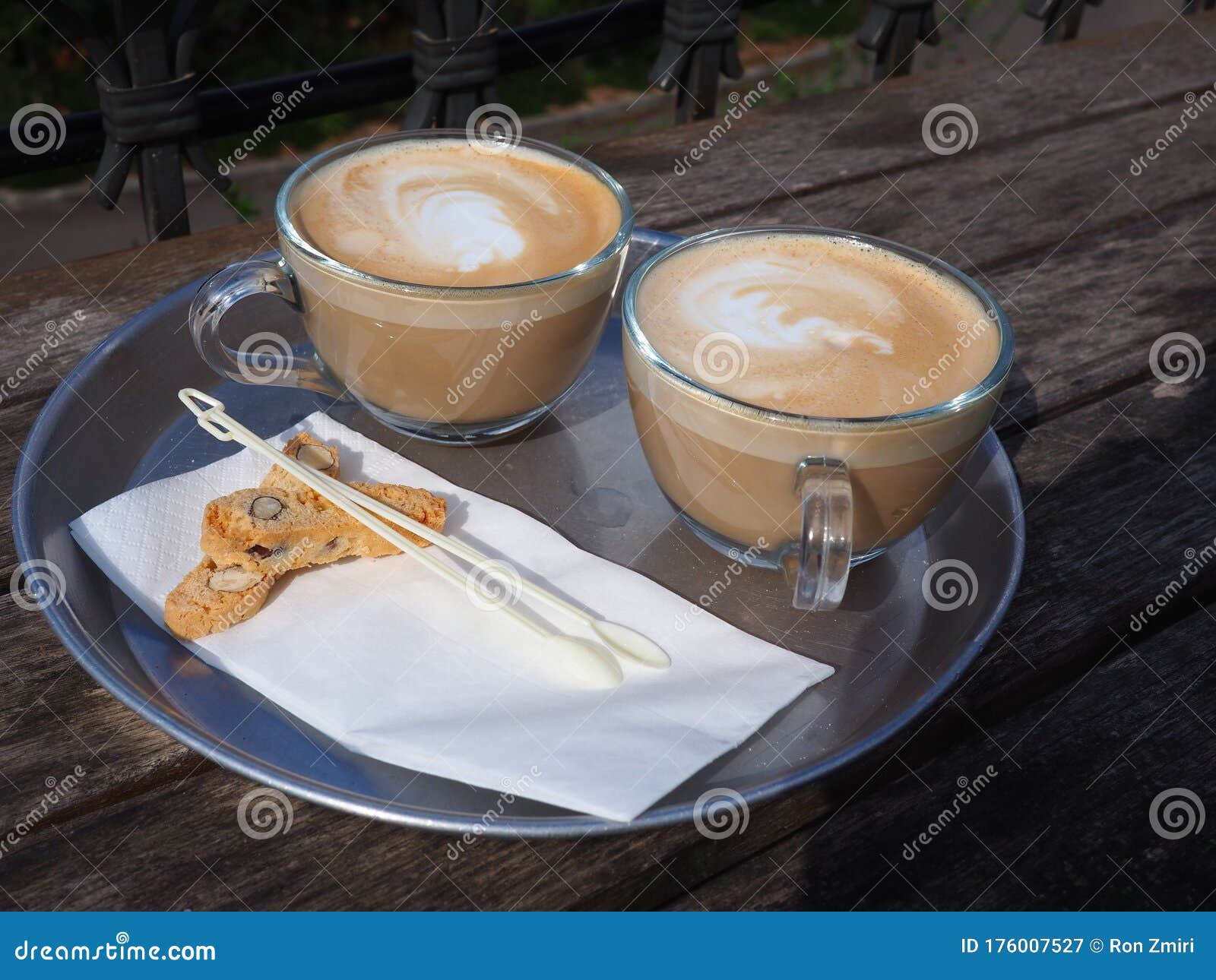 cups of fresh cappuccino coffee latte served with coockies