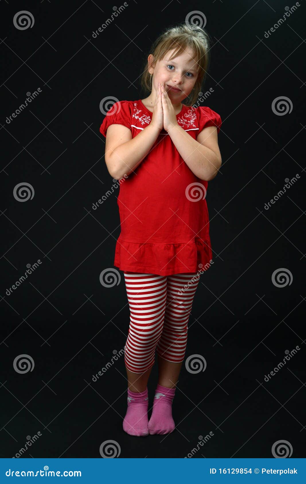 Curious Small Girl With Clasped Hands Smiling Stock Images 