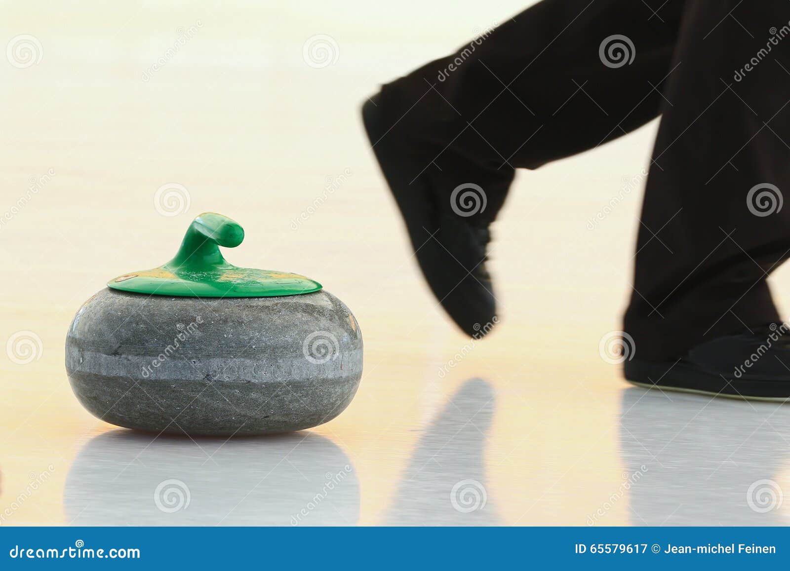 Curling Stone Sliding Down Ice Player S Feet Running Front 65579617 