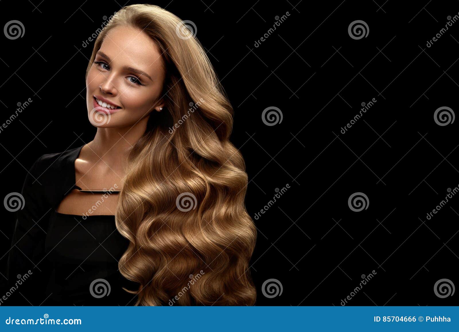 curly blonde hair. beauty model with gorgeous volume hair