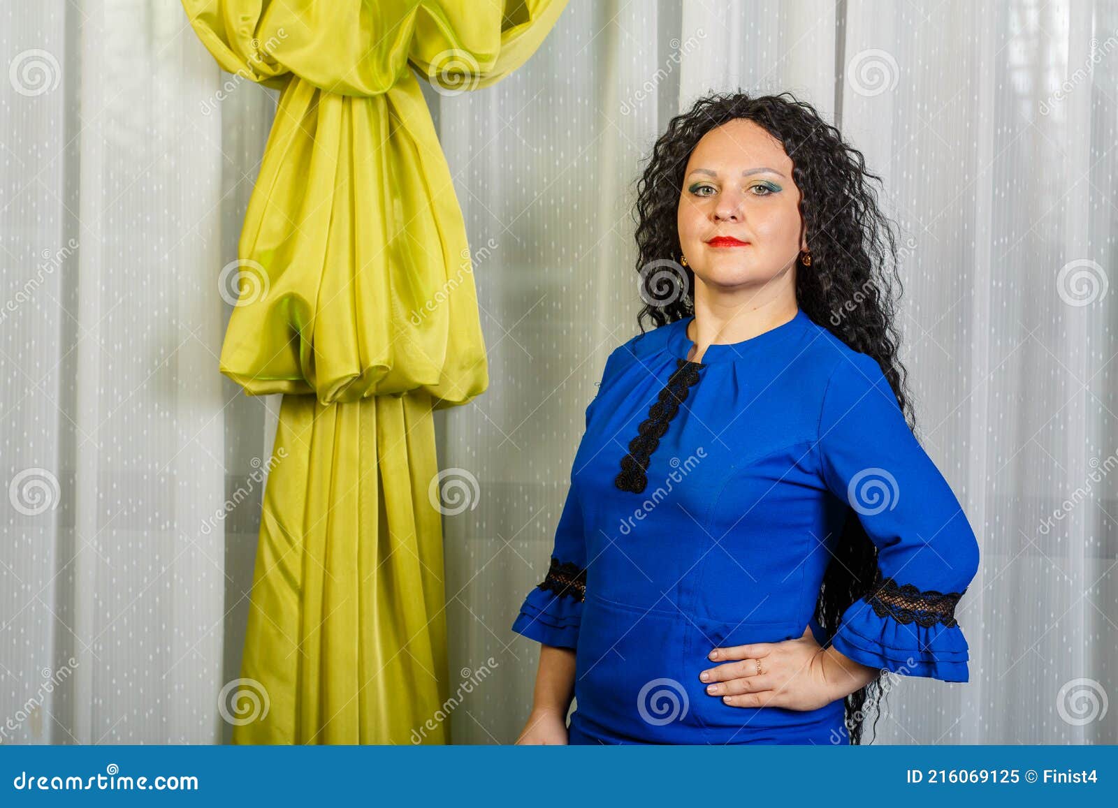 Curly Brunette Woman In Blue Dress Posing Stock Image Image Of Desk Billboard 216069125
