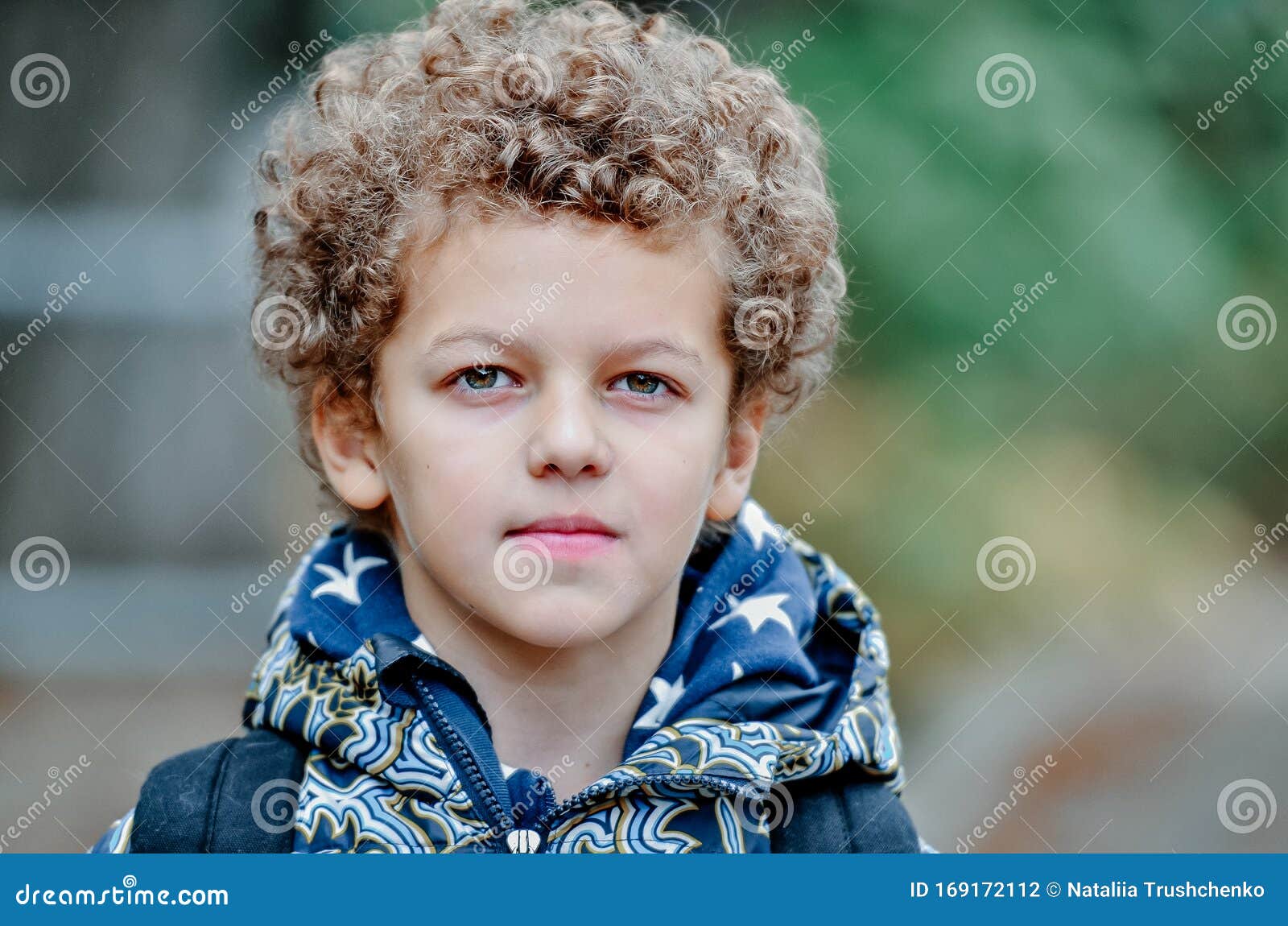 Cool Charming Child Boy with Curly Hair Goes from School with a Big Green  Backpack Stock Photo - Image of lifestyles, eyes: 169172112