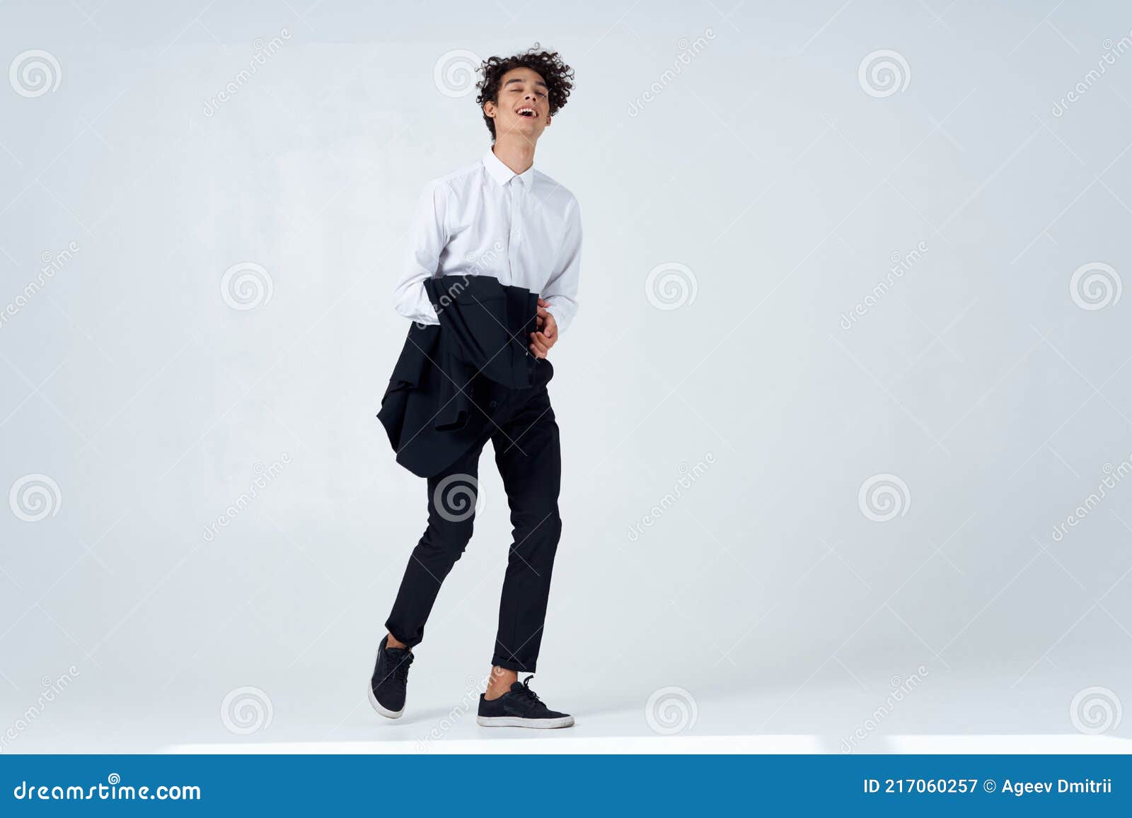 Curly Guy in Suit Jacket in Hands Posing Lifestyle Modern Style Stock ...