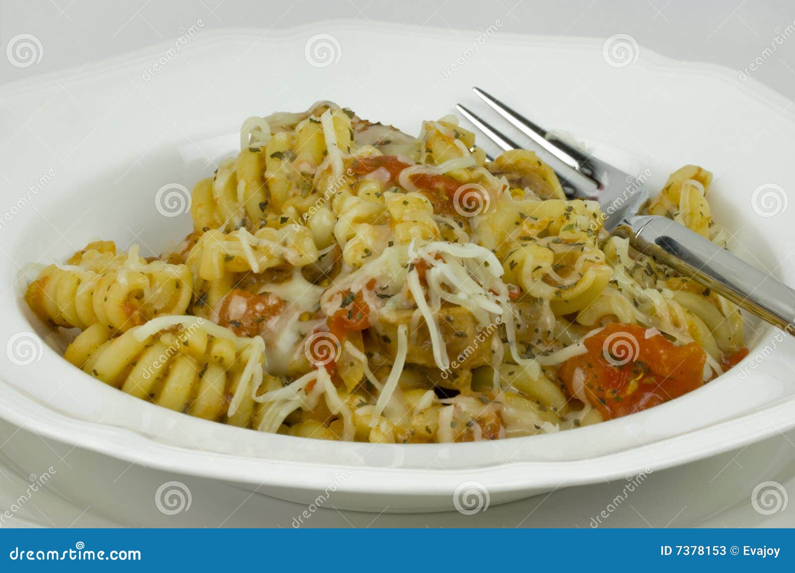 Curly Pasta in White Dish stock image. Image of herb, dinner 7378153