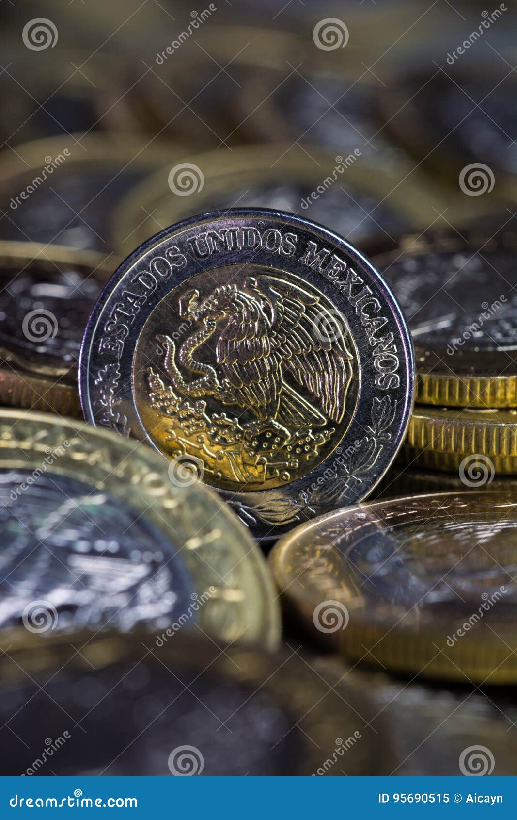 currency of a mexican peso between more coins