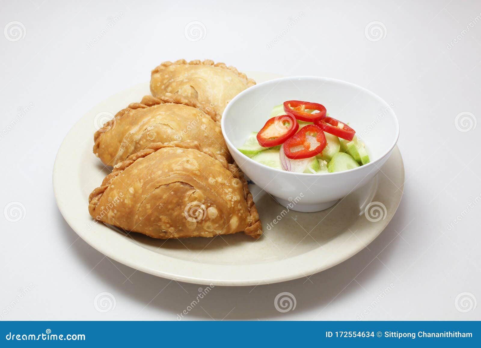 curry puff in a dish serve with spicy sour cucumber
