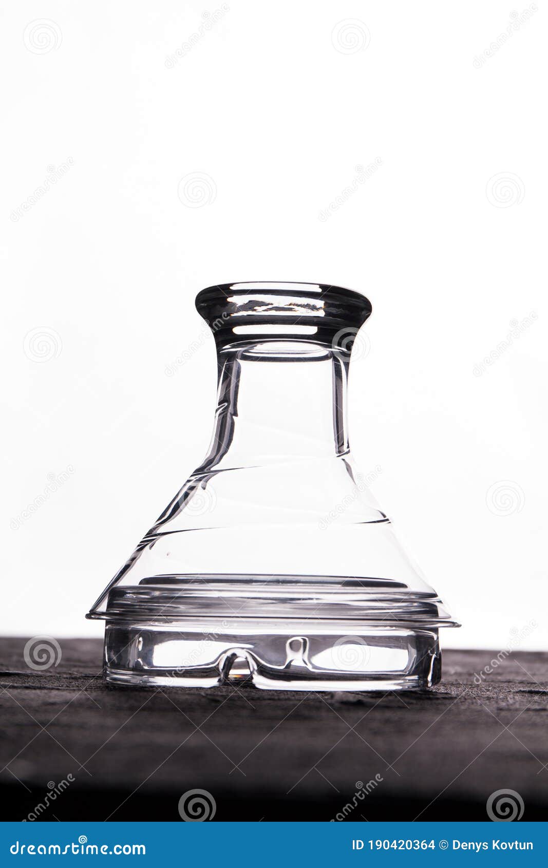 https://thumbs.dreamstime.com/z/curved-glass-cup-placed-bottom-up-isolated-white-background-190420364.jpg