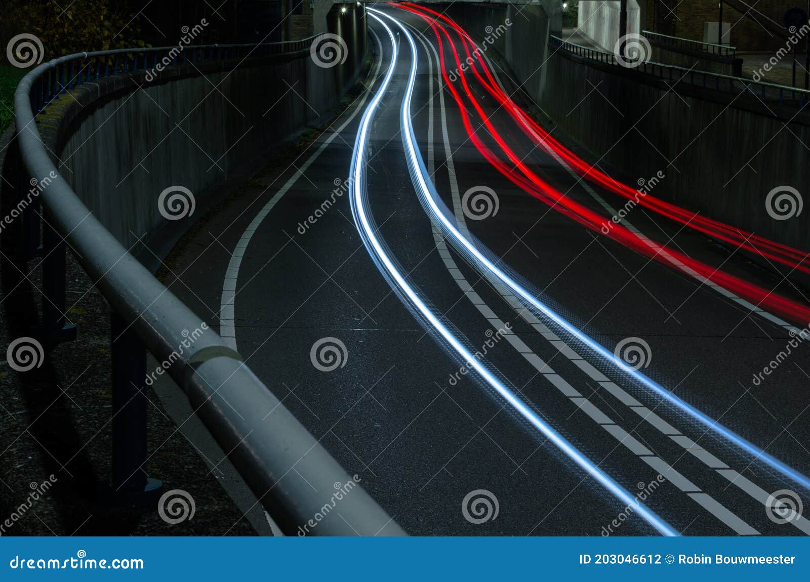 Curved Light Trails from Car Lights Across the Road Stock Photo Image