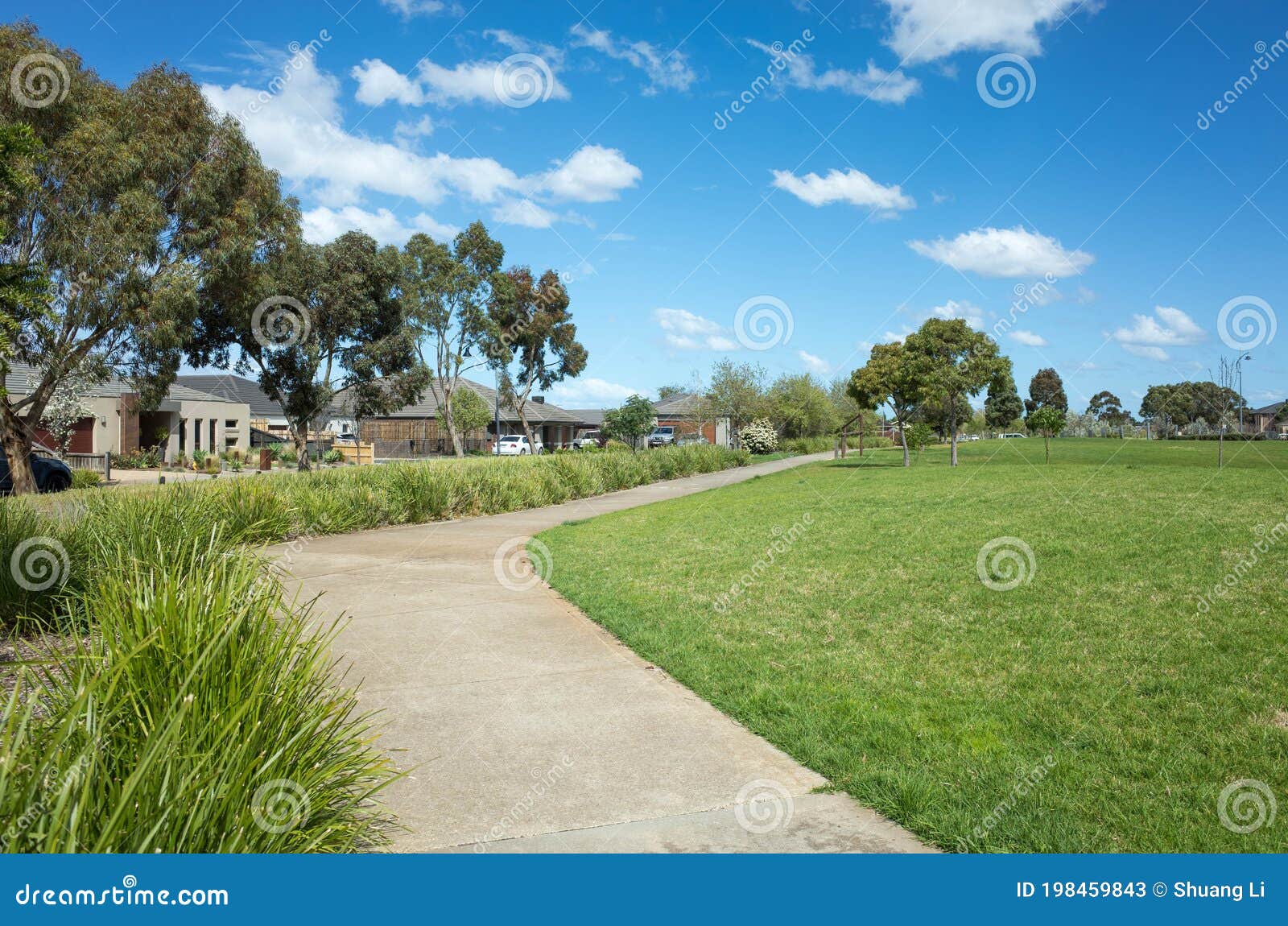 A Curved Footpath/walkway in a Suburban Park with Some Australian Homes/houses in the Distance. Background Stock Image - Image of australian, green: 198459843