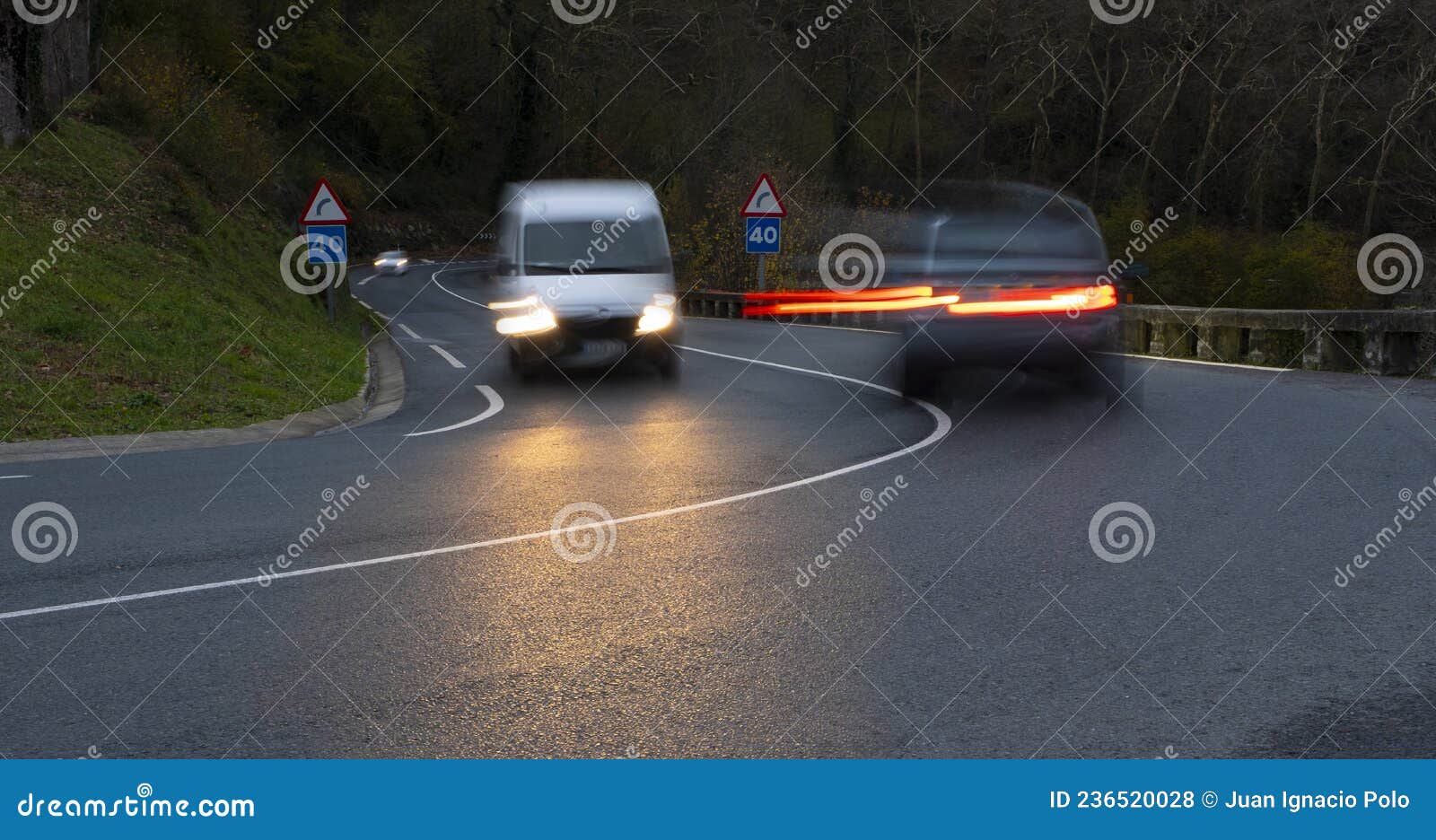 Curvy road and car lights stock photo. Image of blur 236520028