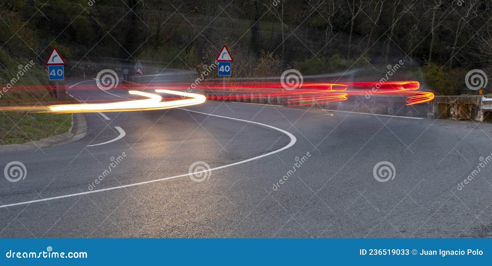 Curvy road and car lights stock image. Image of motion 236519033
