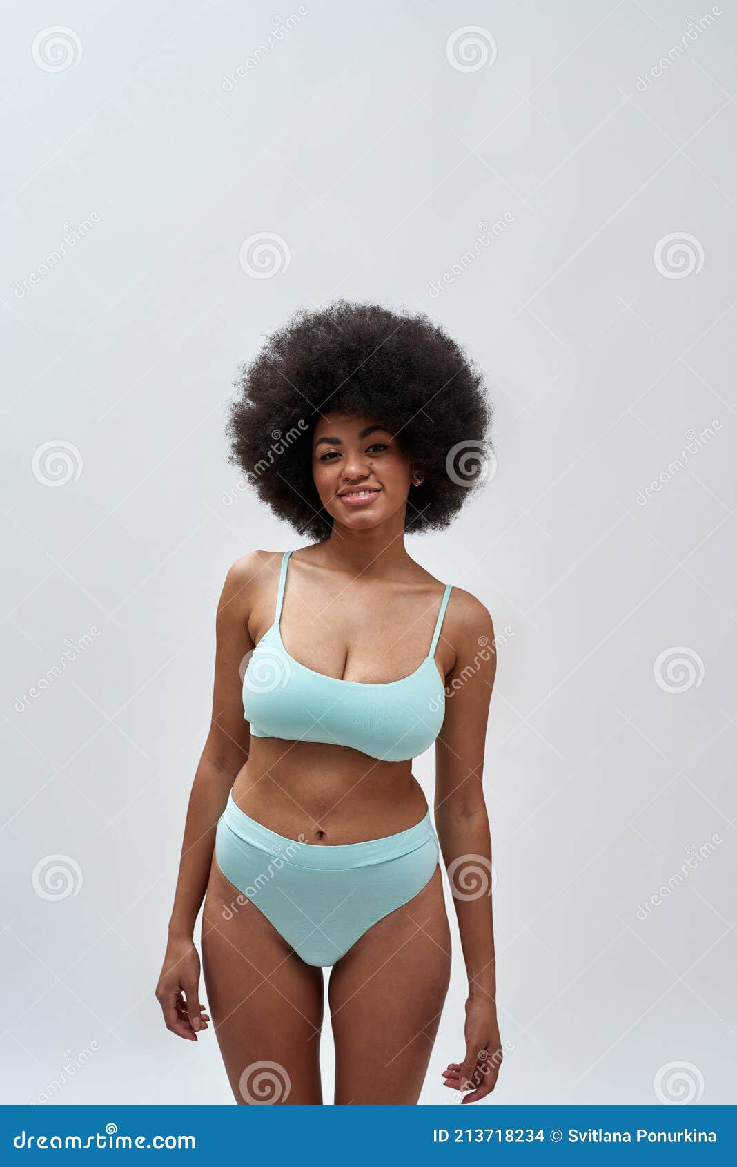 Curvy Young Woman with Afro Hair Style Wearing Blue Underwear