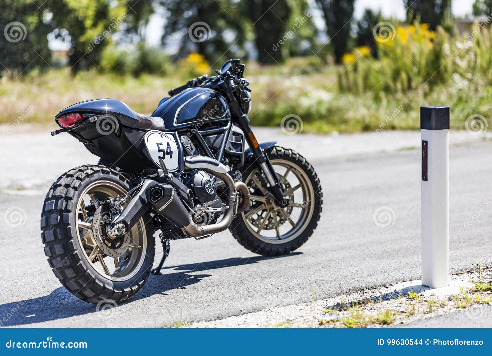 custom made scrambler style cafe racer standing on road