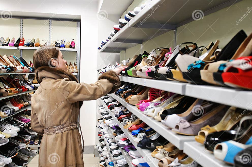 Customer checking shoes editorial photography. Image of male - 23489277