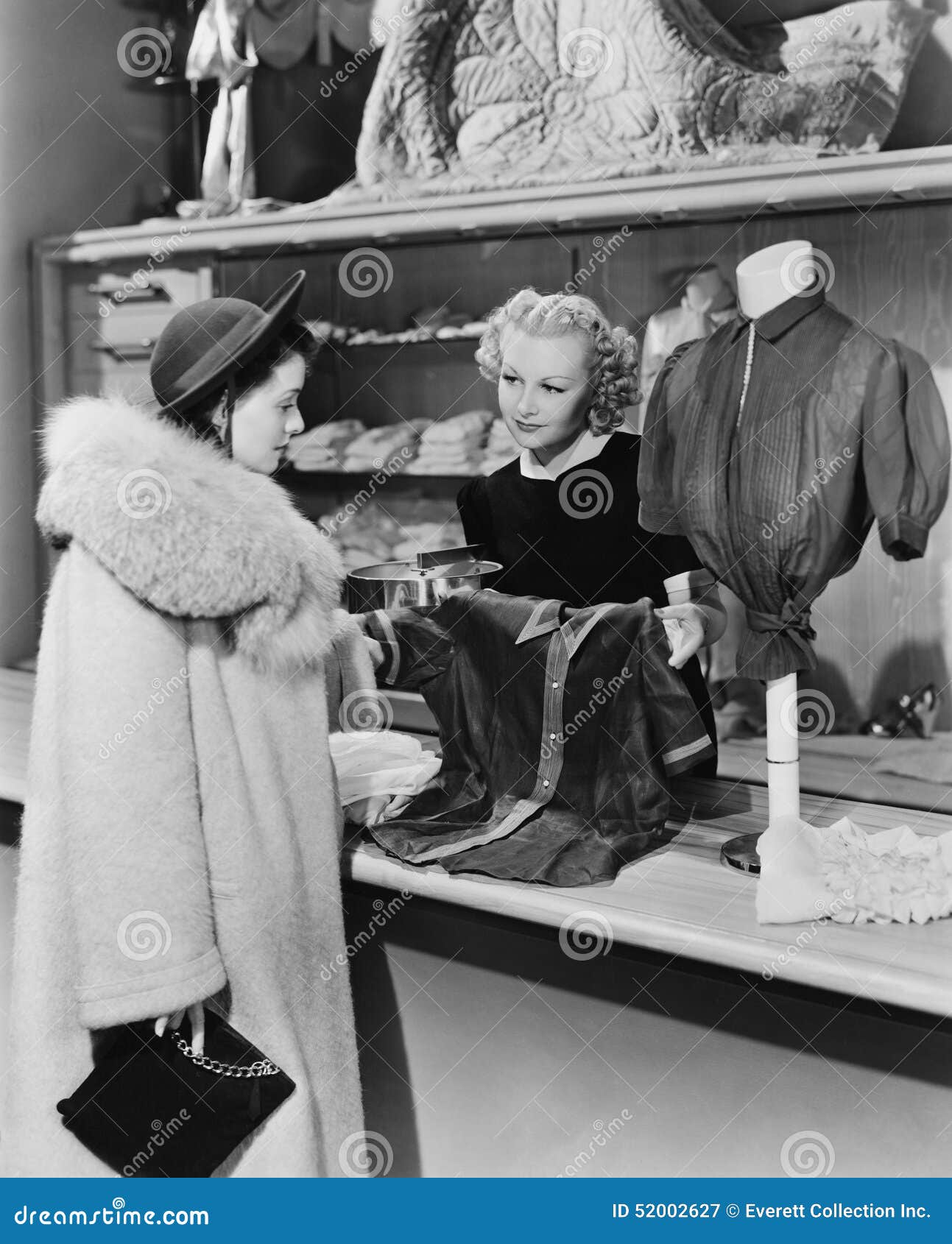 customer and clerk in clothing store