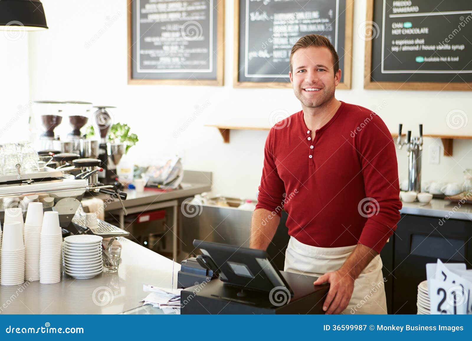 customer paying in coffee shop using touchscreen