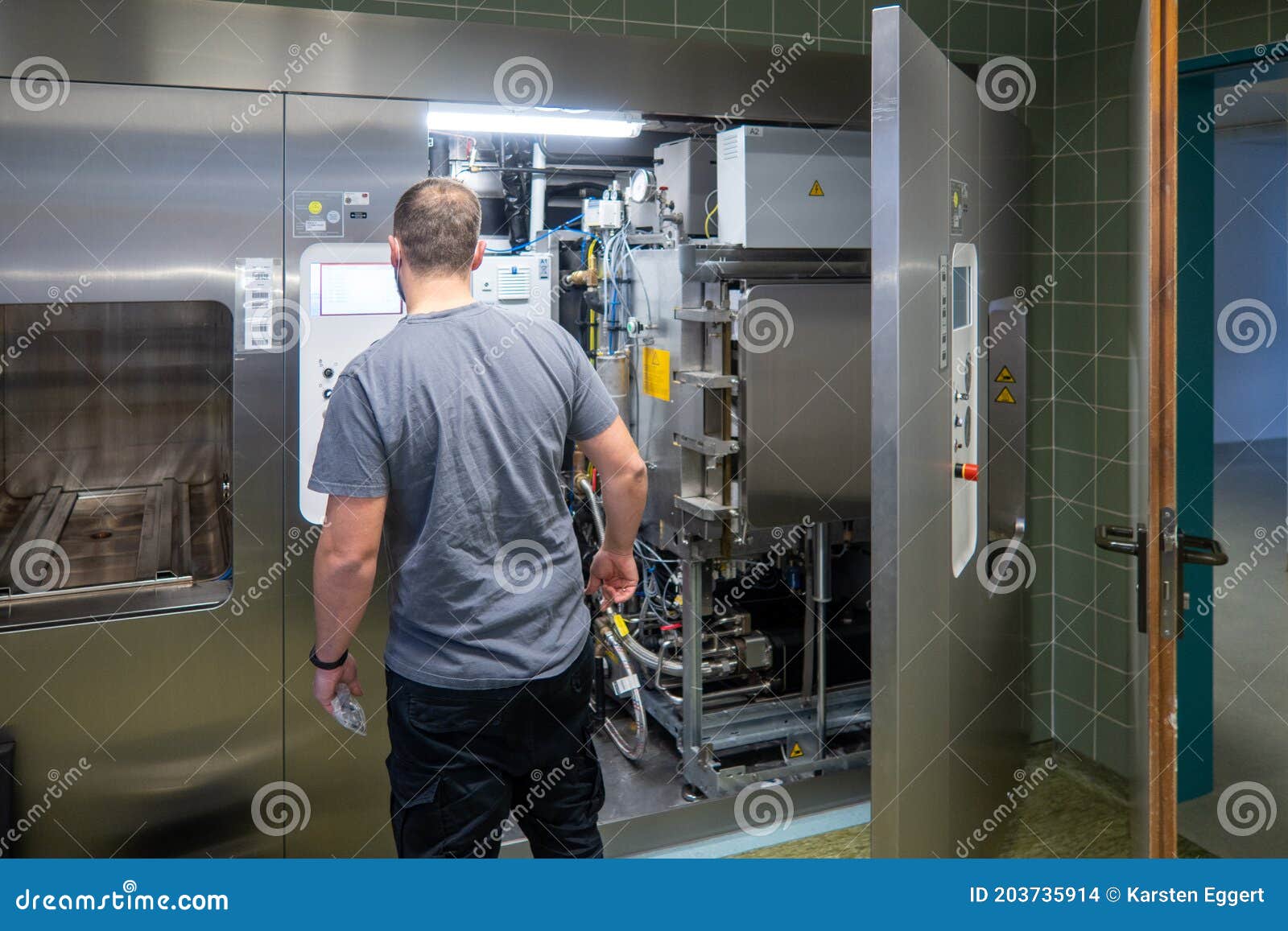 Customer Service Representative Repairs a Steam Sterilizer in a