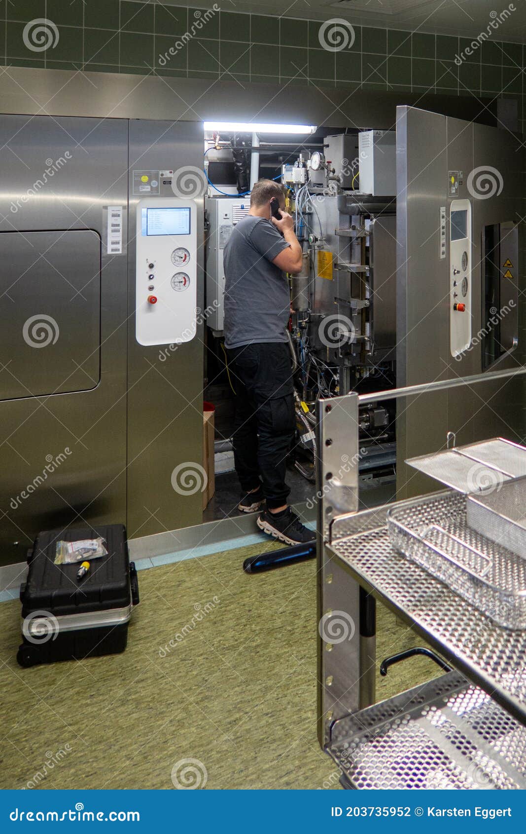 Customer Service Representative Repairs a Steam Sterilizer in a