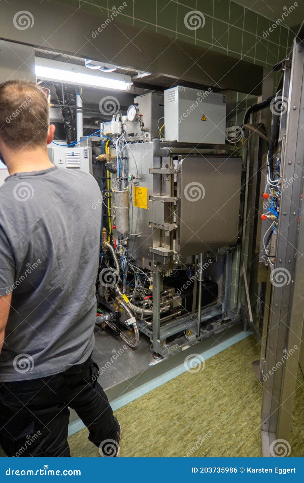 Customer Service Representative Repairs a Steam Sterilizer in a