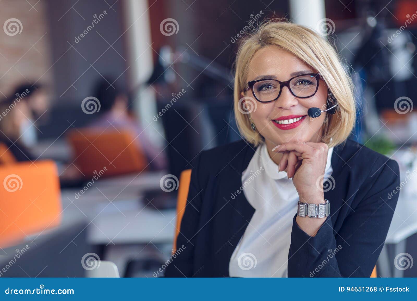 customer service representative at work. beautiful young woman in headset working at the computer