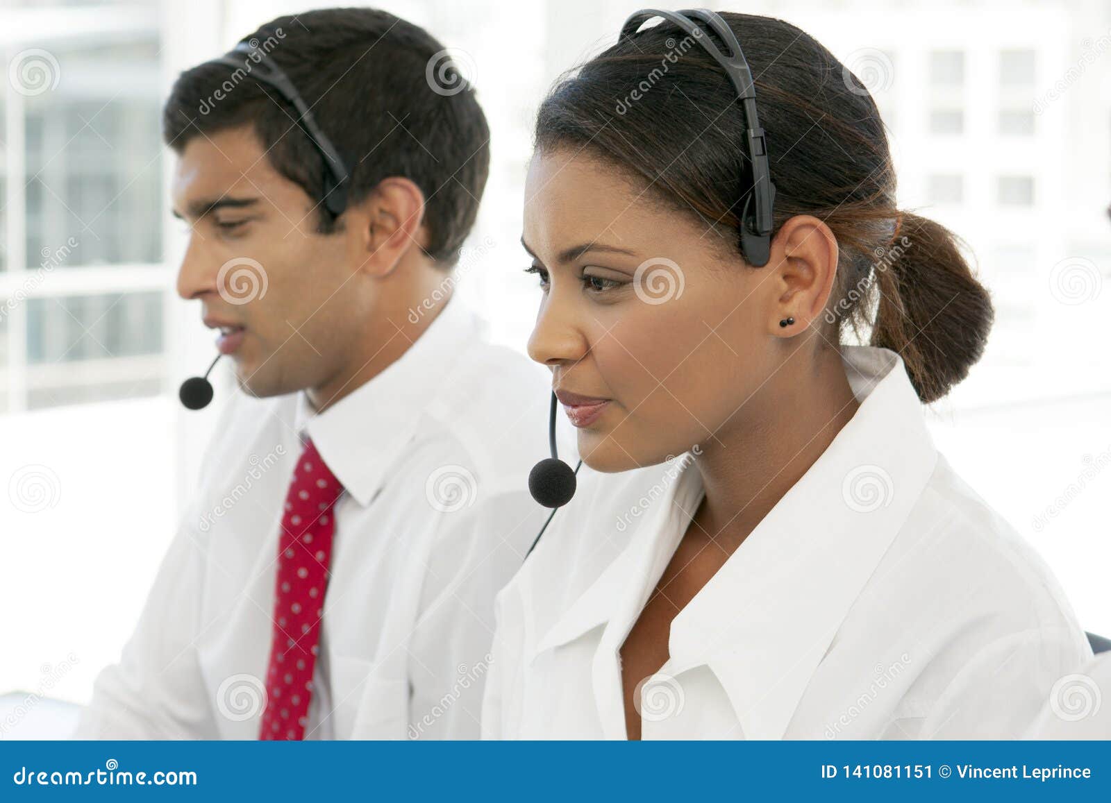 customer service representatives at work in multiethnic call center