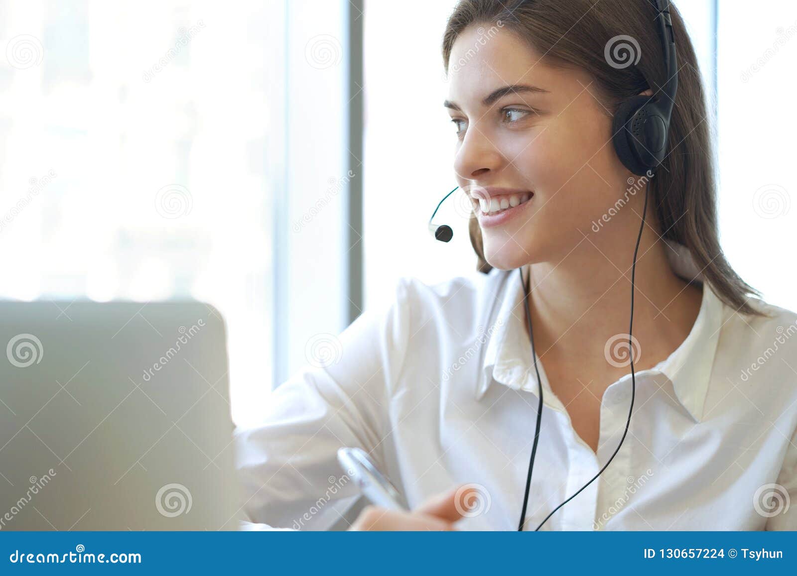 customer support operator working in a call center office.