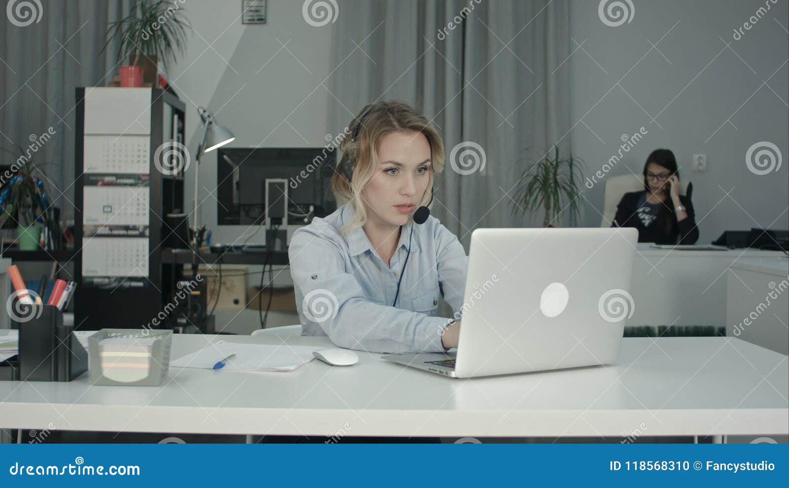 Customer Support Operator Working In A Call Center Office Stock