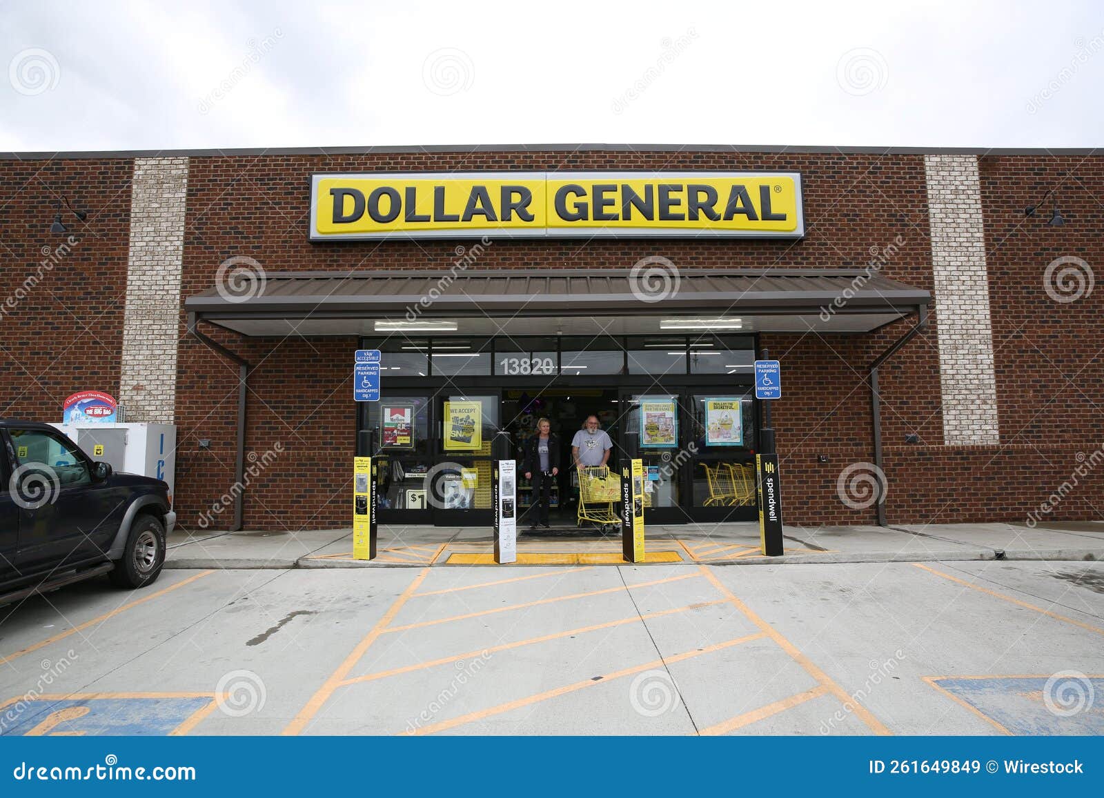 Customers Exiting Dollar General with Carts Full of Items Editorial