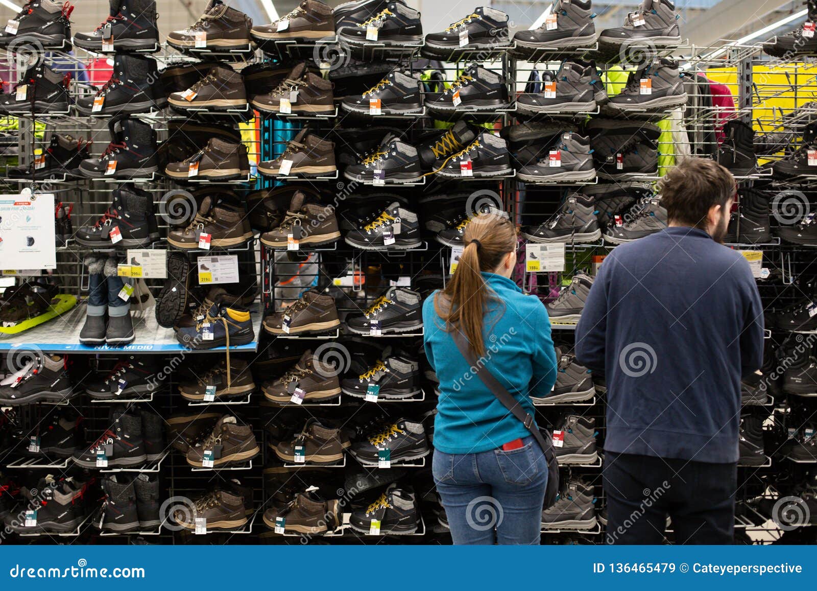 Customers in Front of Winter Sneakers Shelf in the French Sporting ...