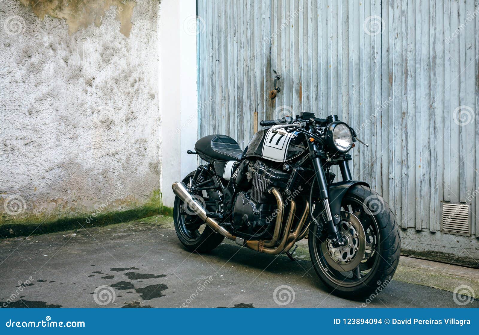Customized Motorcycle in Front of Garage Door Stock Photo Image of