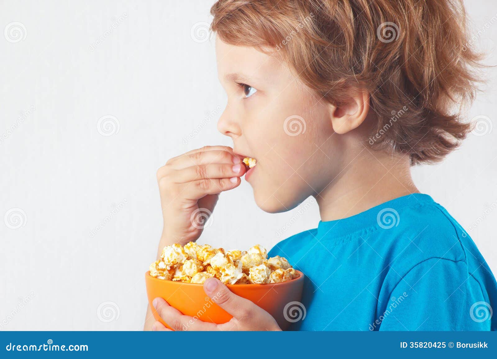 Cut child eating popcorn stock image. Image of movie 35820425