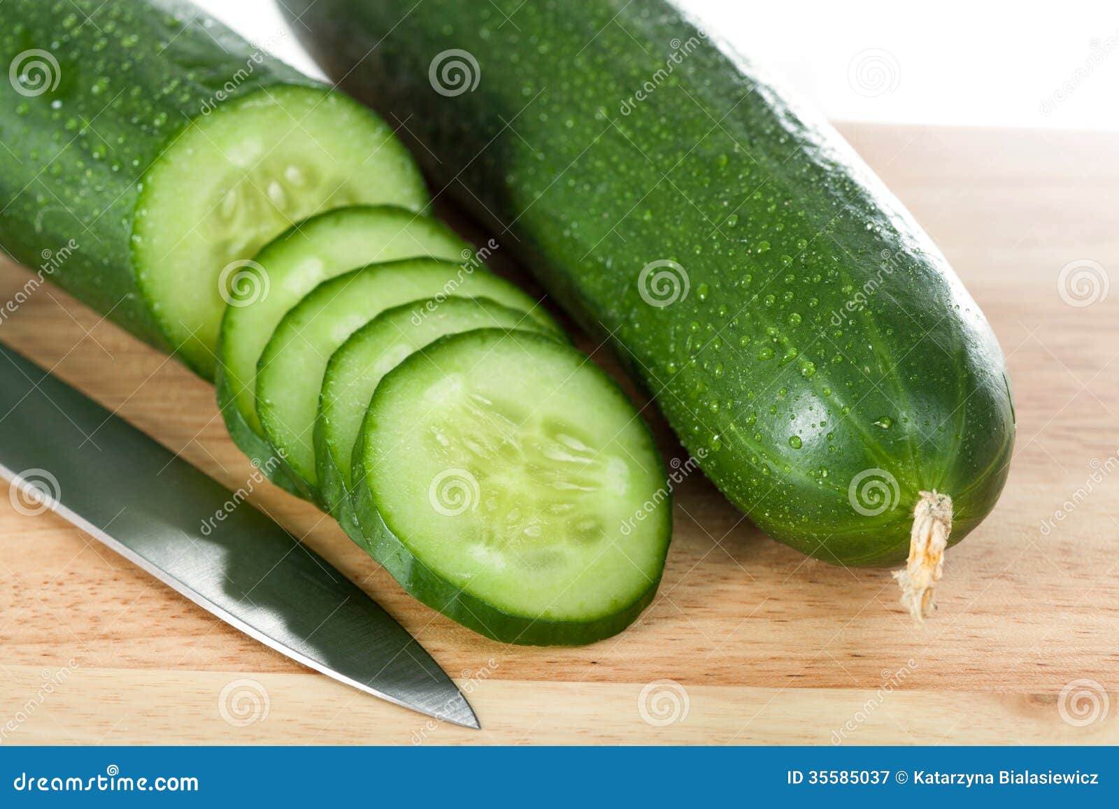 cut cucumbers and knife