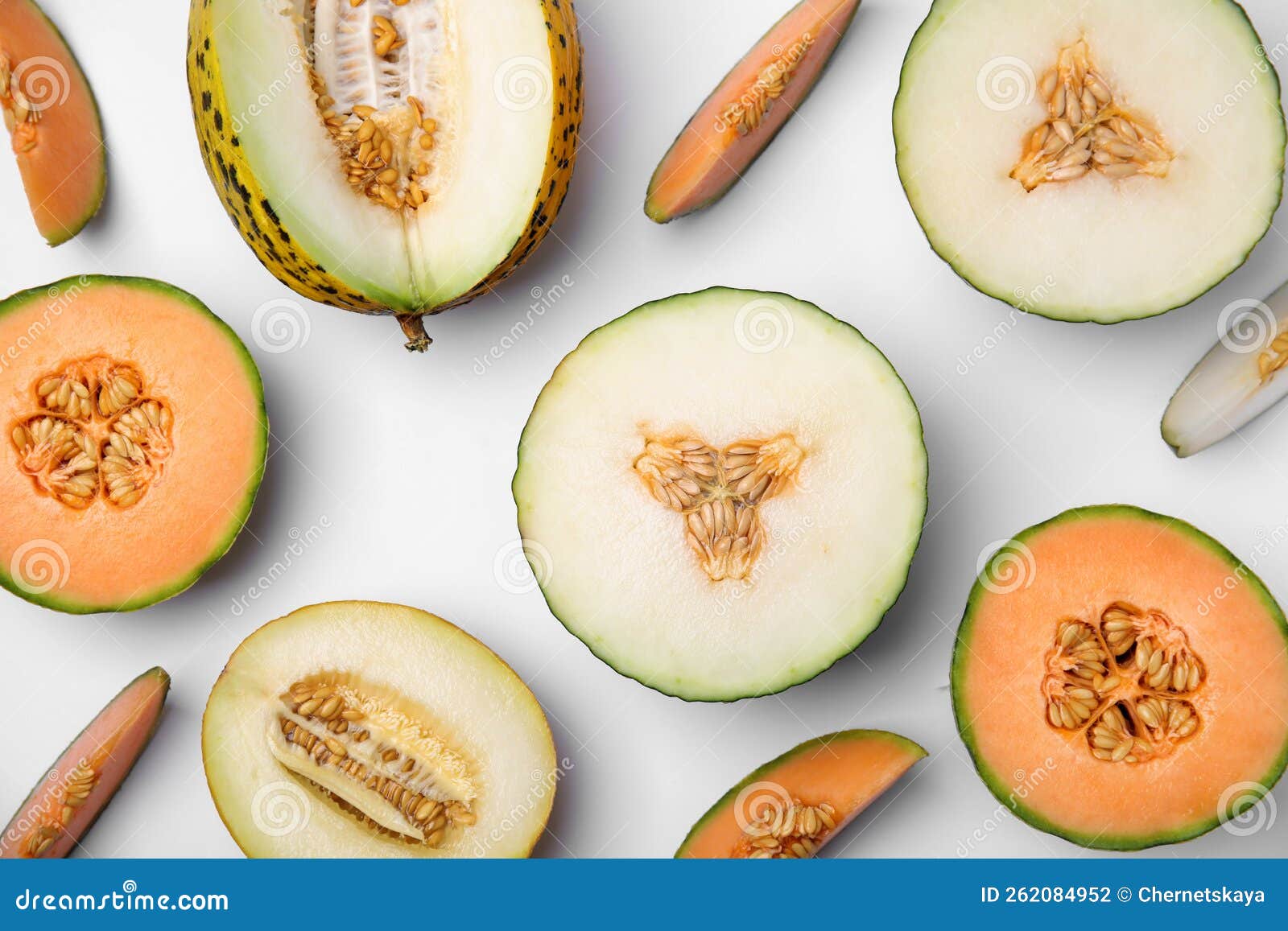 Cut Different Types of Melons on White Background, Flat Lay Stock Photo