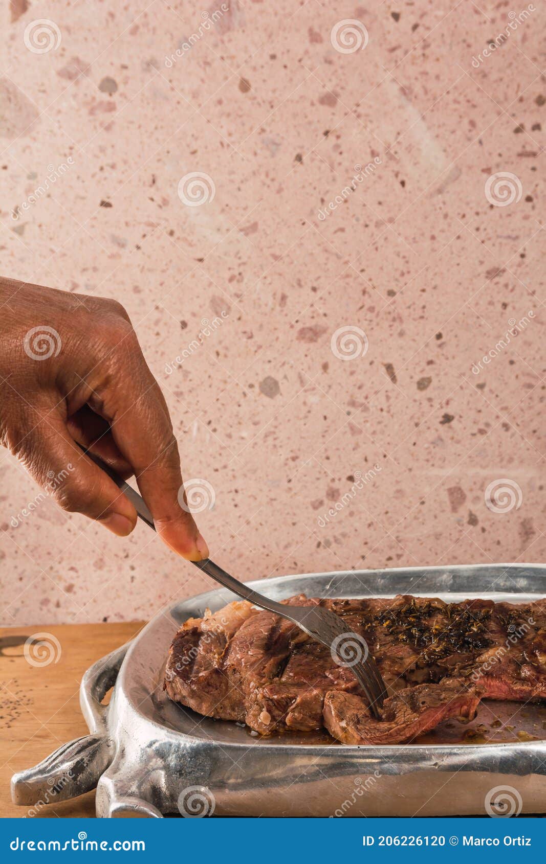 cut of meat `aguja norteÃÂ±a sonora`, served on a silver plate in the  of a cow 4