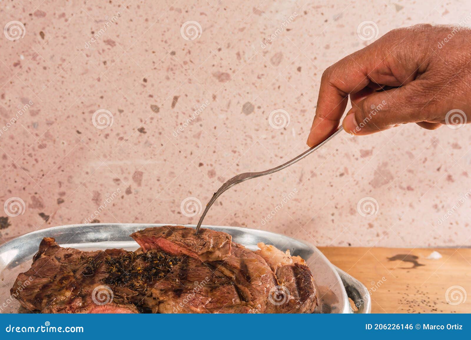 cut of meat `aguja norteÃÂ±a sonora`, served on a silver plate in the  of a cow 3