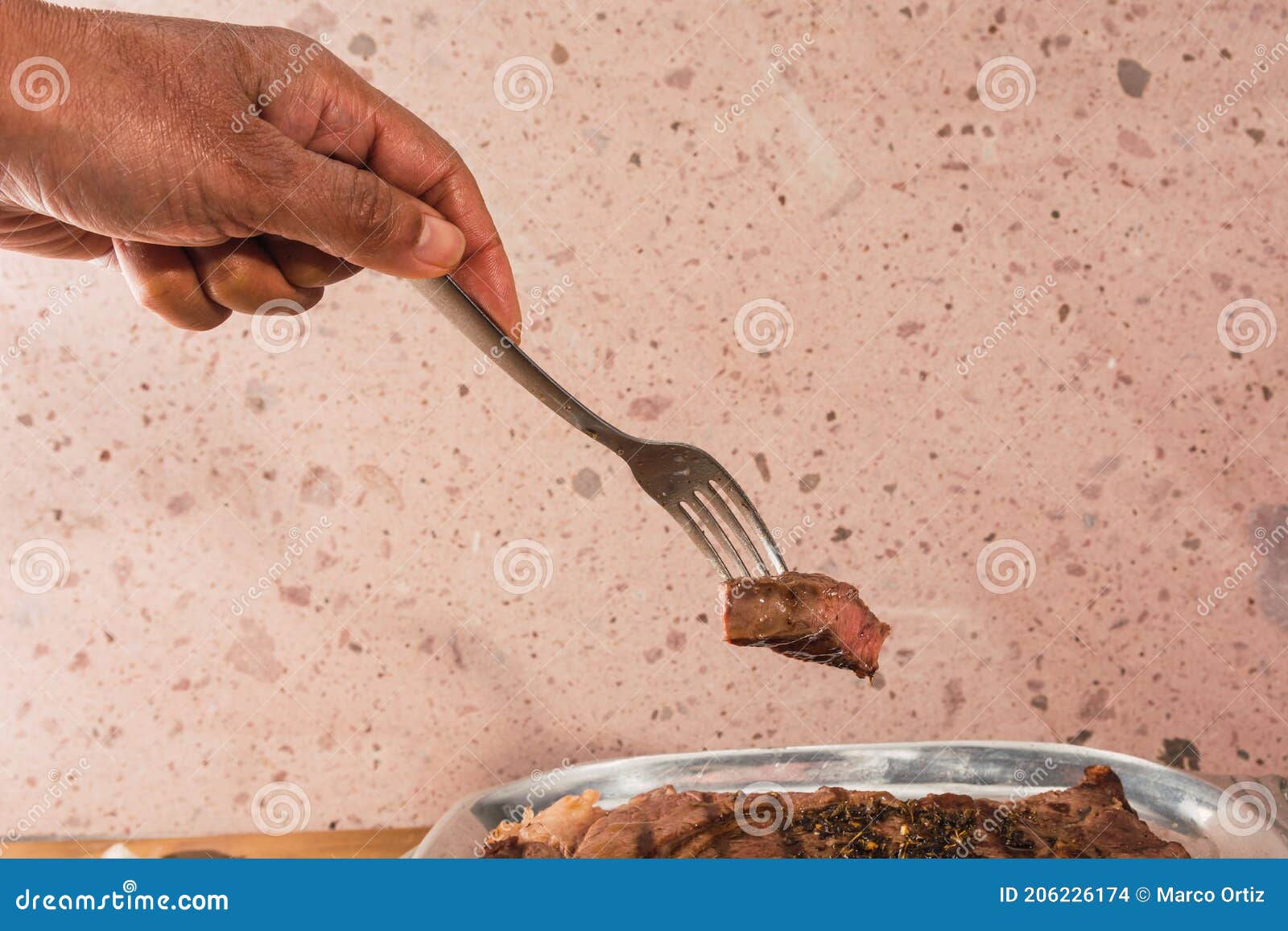 cut of meat `aguja norteÃÂ±a sonora`, served on a silver plate in the  of a cow 2