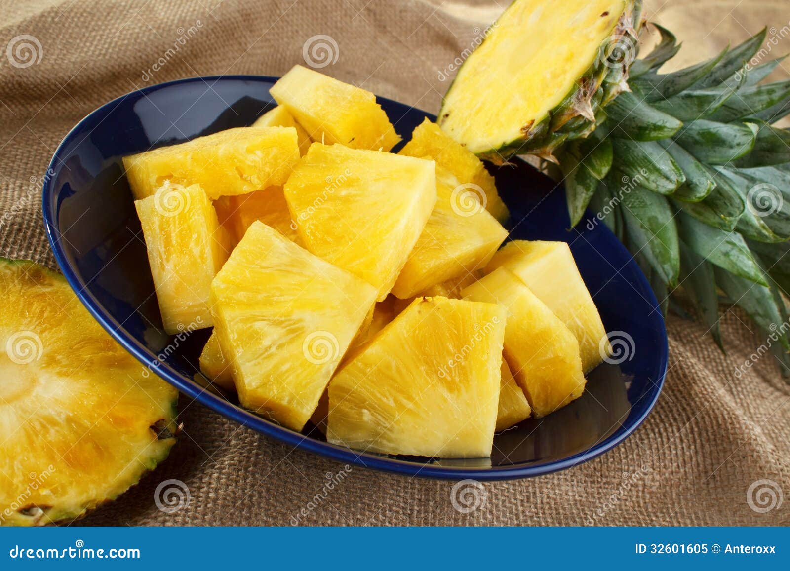 Sliced Pineapple In A Bowl On A Cutting Board With A Knife And A Whole  Pineapple Stock Photo - Download Image Now - iStock
