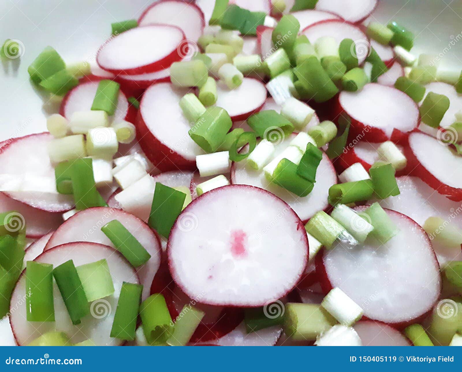 cut radishes and spring onion for salad