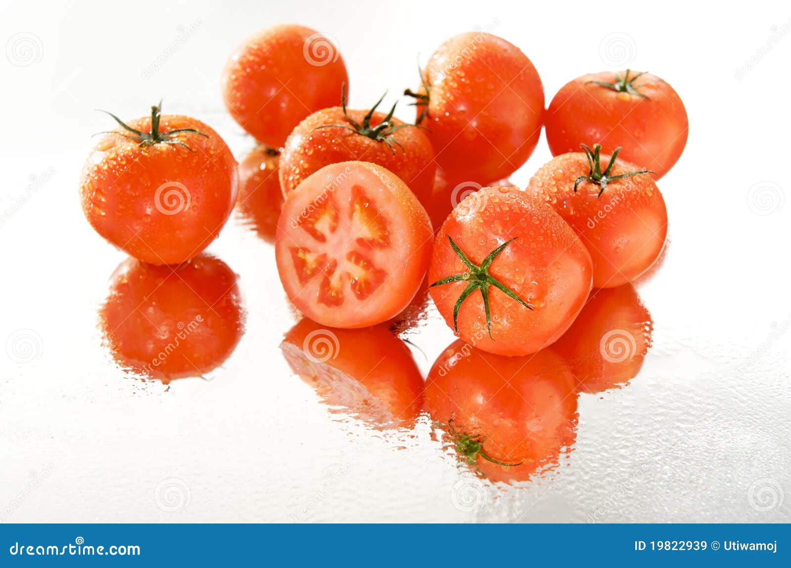 Cut tomato in wet group on mirror