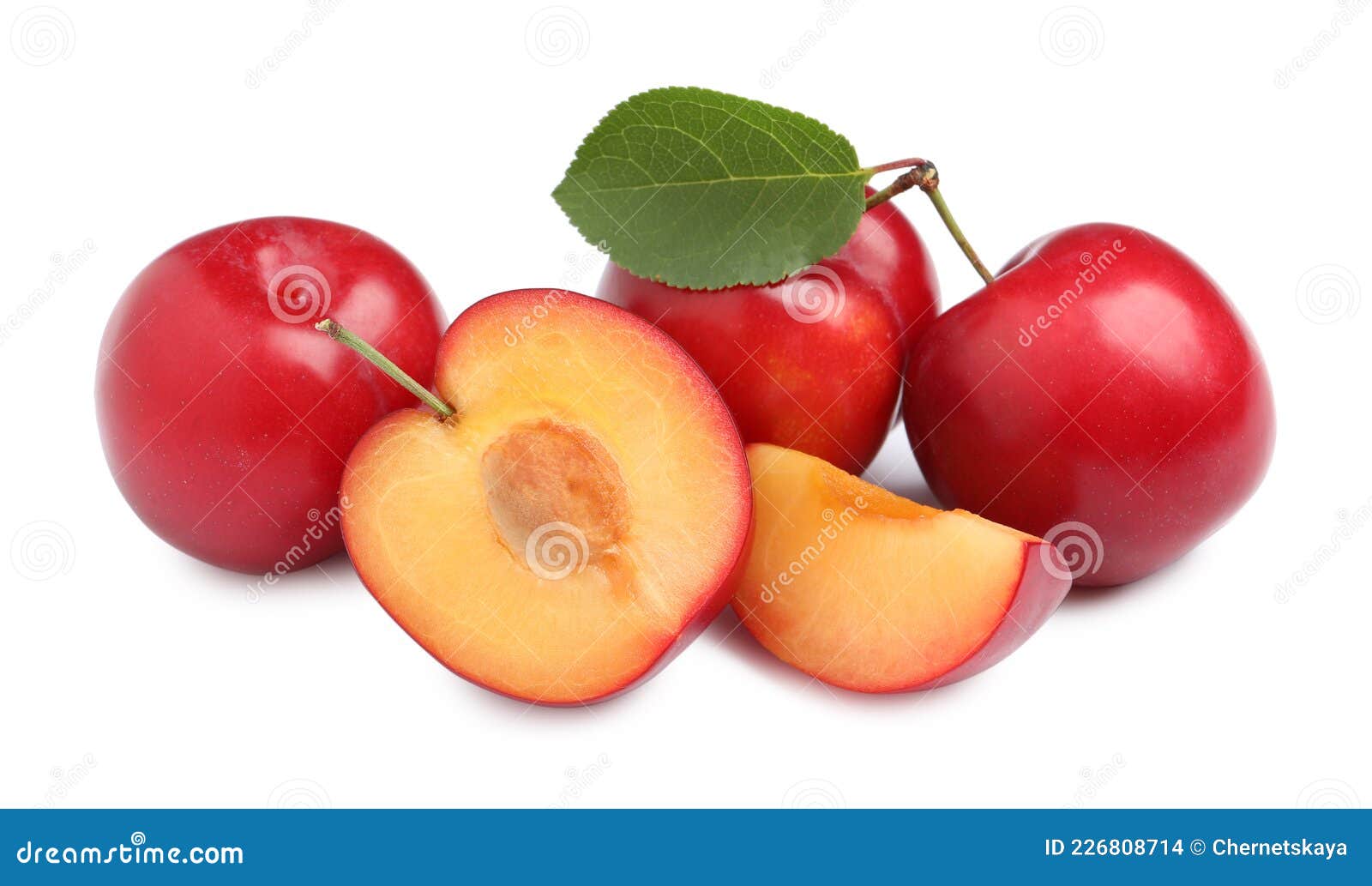 Cut and Whole Cherry Plums with Leaf on White Background Stock Photo