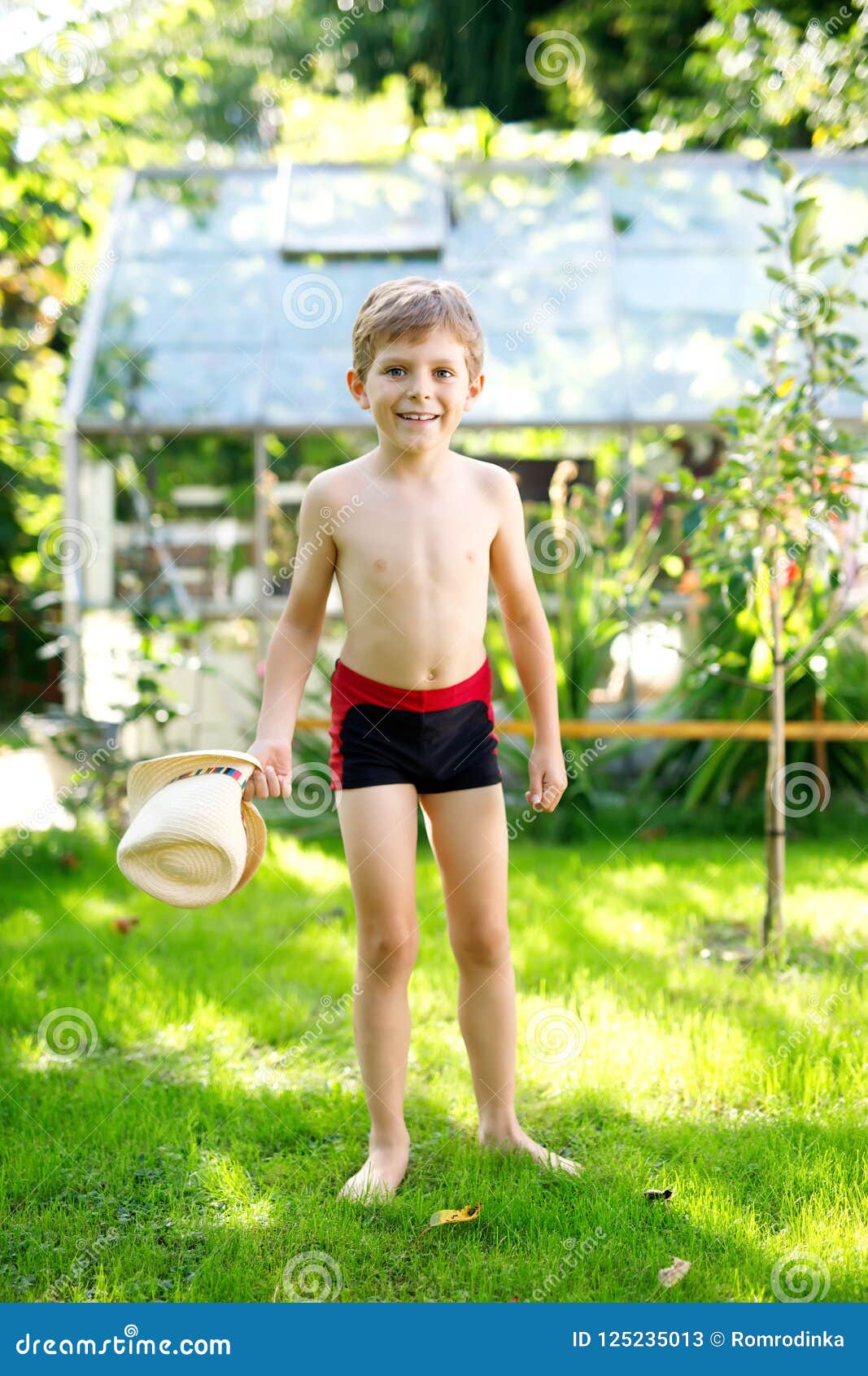 Cute Active Kid Boy Jumping in the Garden on Warm Sunny Summer Day ...