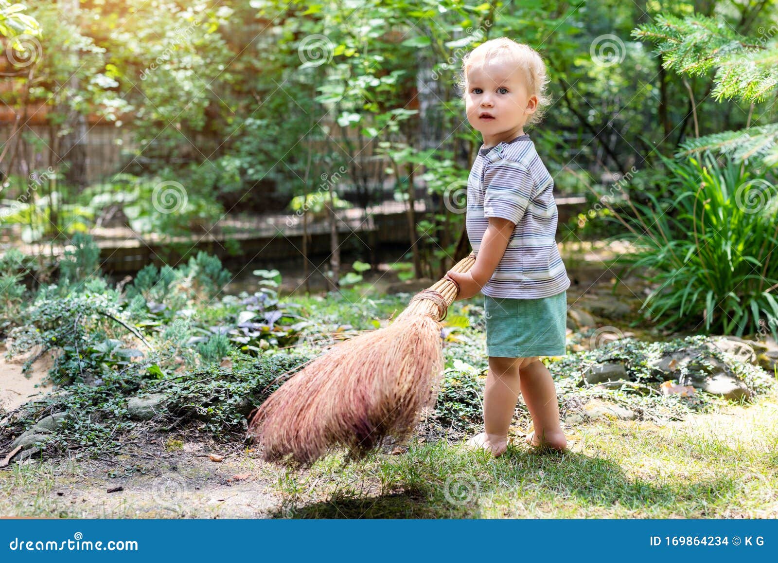 Cute Adorable Caucasian Toddler Boy Playing Holding Broom at Backyard ...