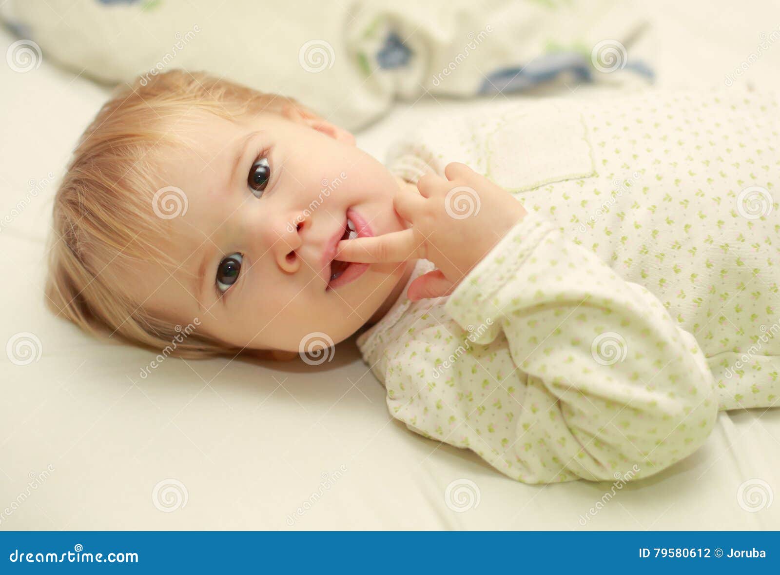 Cute adorable child in bed stock photo. Image of lying 79580612
