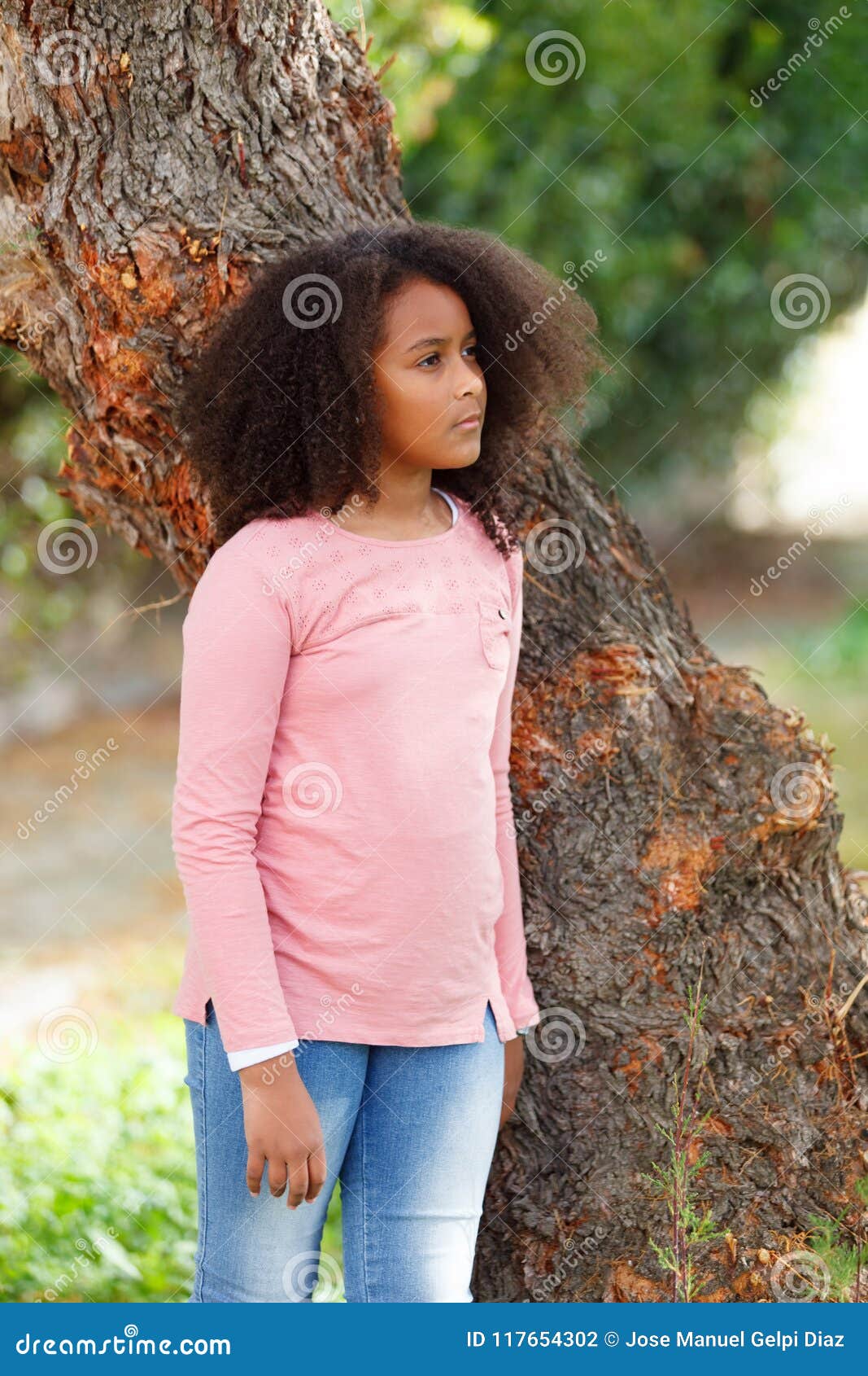 Cute African American Girl In The Street With Afro Hair Stock