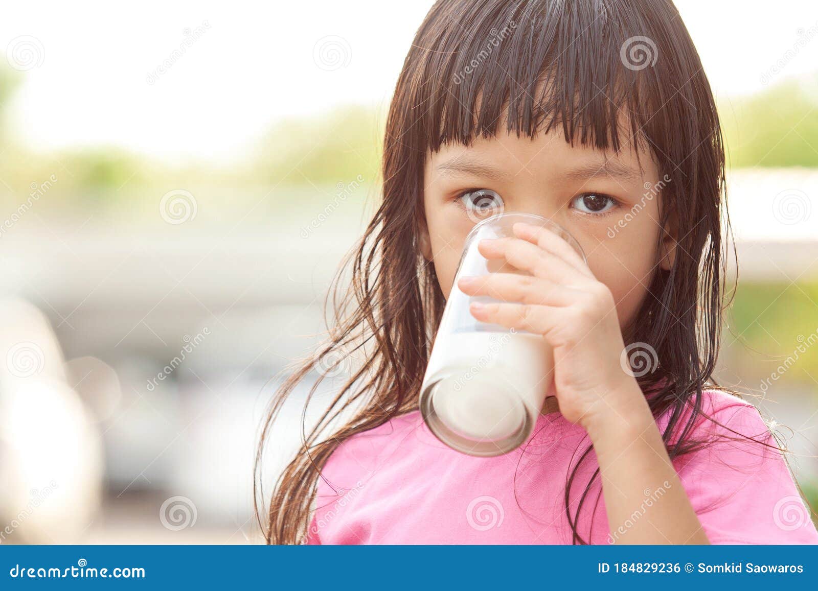 Cute Asian Girl with Long Hair Wearing a Pink Shirt Right Hand Holding a Glass of Milk Drinking Milk in a Glass Drinking Milk Stock Photo - Image of fresh, hand: 184829236 Cute Asian Girl with Long Hair Wearing a Pink Shirt Right Hand Holding a Glass of Milk Drinking Milk in a Glass Drinking Milk Stock Photo - Image of fresh, hand: 184829236
